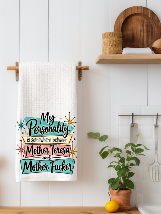 "Funny sarcastic kitchen towel that reads My personality is somewhere between Mother Teresa..., designed, printed, and pressed by SassySotaGirl."